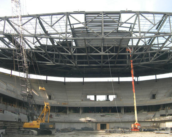 Andrew hanging on ropes below Seattle's iconic Space Needle.